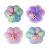 Four colorful paw-shaped squishies with cartoon characters on a white background