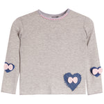 A light gray long-sleeve top for kids, featuring blue denim heart patches with pink bows on the sleeves and lower front, and a pink beaded collar.