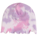 A knit beanie hat featuring a pink and purple tie-dye pattern with a scalloped edge, shown against a plain white background.