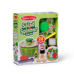 Melissa & Doug Salad Spinner Play Set in its original retail packaging, featuring a green and white striped box with a clear window showing the toy set inside.