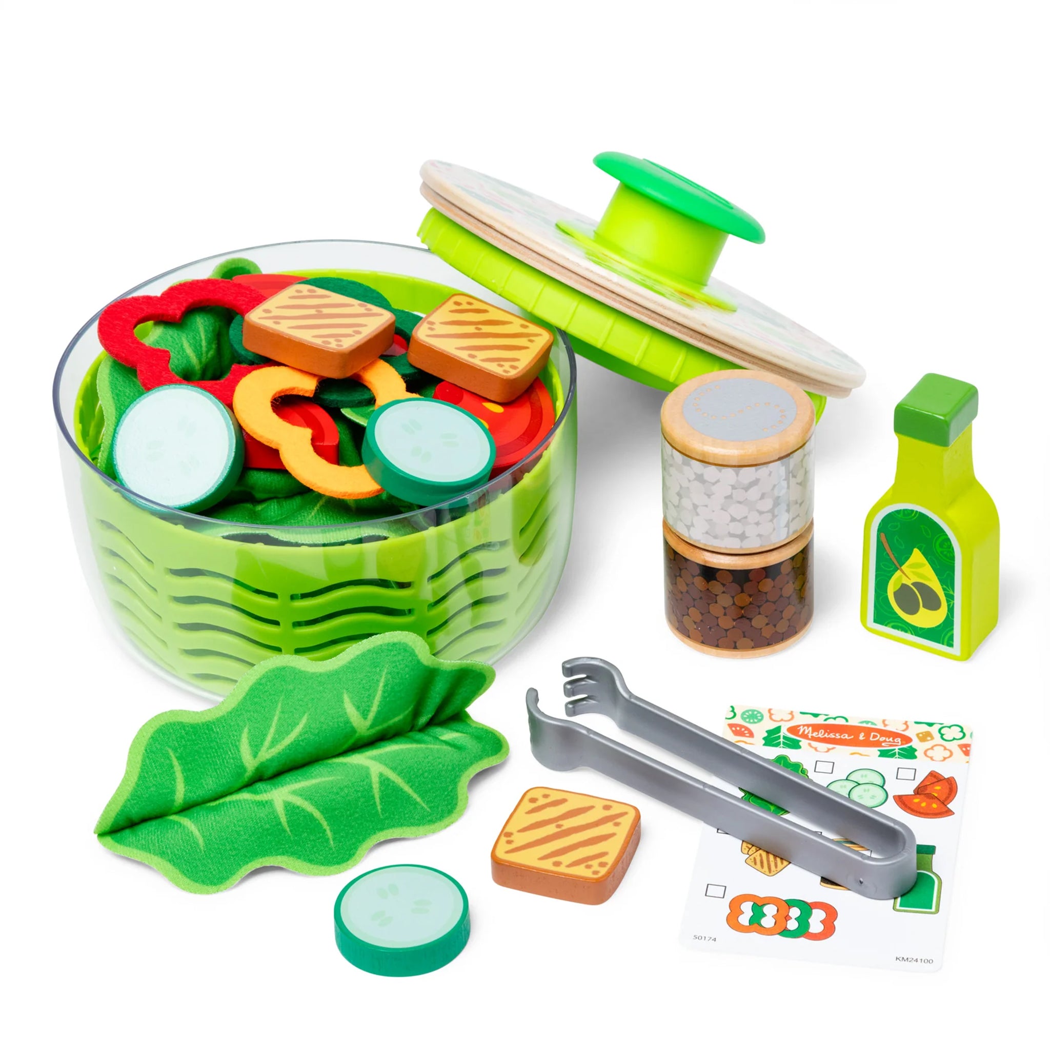 Toy salad set with various components on a white background