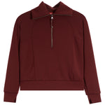 Spanx dark burgundy long-sleeve quarter-zip sweatshirt with a stand-up collar and zippered chest, displayed on a clean white background.