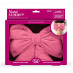 Pink eye pillow with bow design in packaging on a white background
