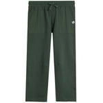 A pair of dark forest green scrub pants with an elastic waistband, drawstring, and side pockets, shown flat on a white background.