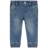 A pair of baby blue denim jeans with a faded wash, ribbed waistband and cuffs, and distressed details on the thighs, shown against a plain white background.