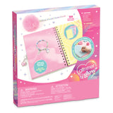 Glimmer & Glow My Own Magic Kit in its retail packaging, featuring a pink notebook, charm bracelet, and other colorful accessories on a white background.