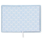 A light blue journal featuring a white trellis pattern and a small white pull tab at the bottom center, shown against a plain white background.
