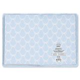 A light blue journey with a white geometric trellis pattern, featuring a soft plush border and a product care label on the right side.