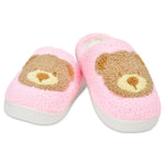 Pair of pink slippers with bear face design on a white background