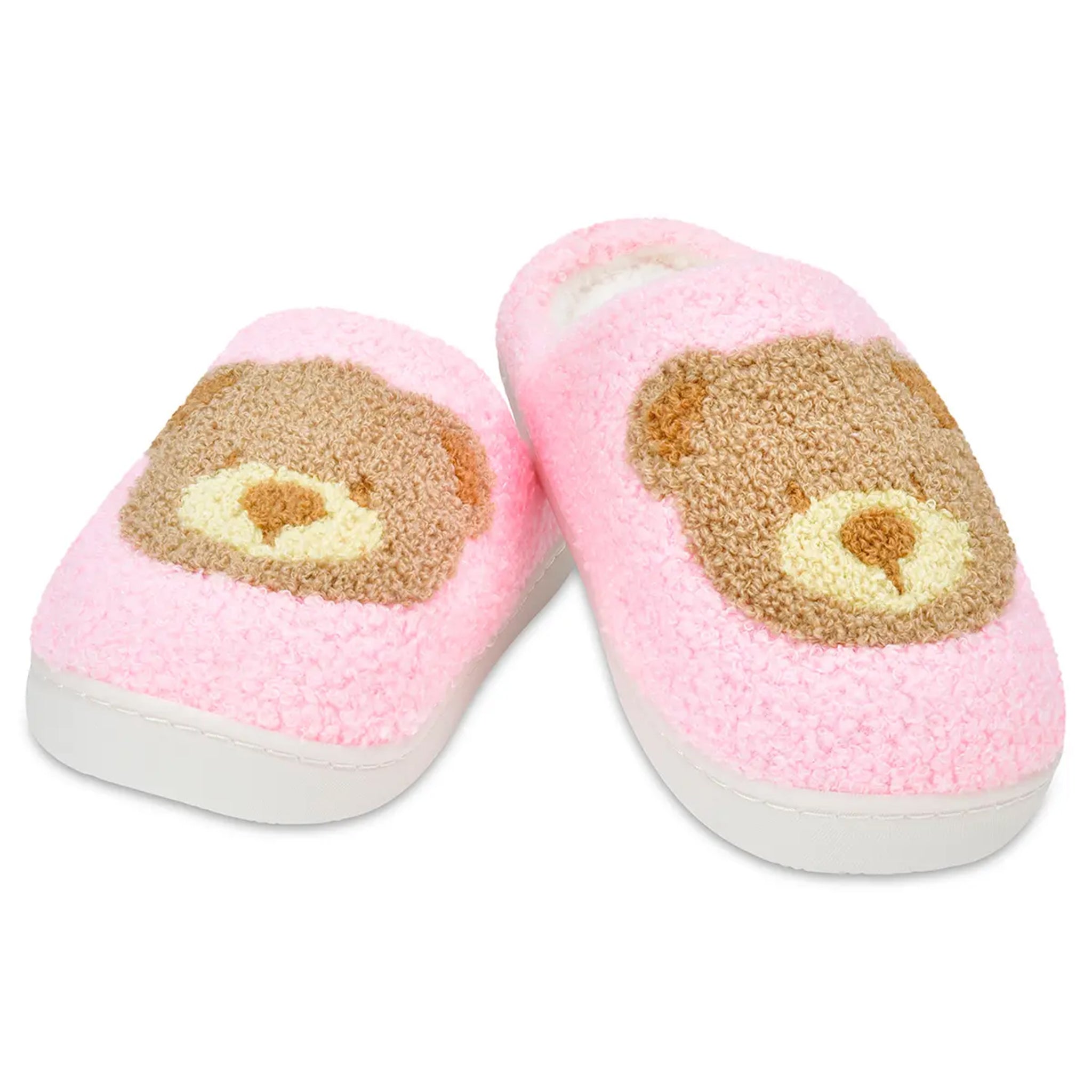 Pair of pink slippers with bear face design on a white background