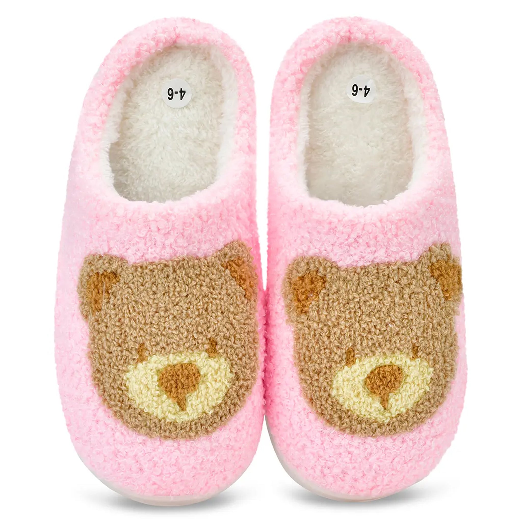 Pair of pink slippers with bear face design on a white background