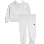 A children's two-piece athletic loungewear set by Jordan, featuring a light heather gray hoodie with a small multicolor Jumpman and number '23' print, paired with matching light heather gray jogger pants with a red Jumpman logo on the left thigh.