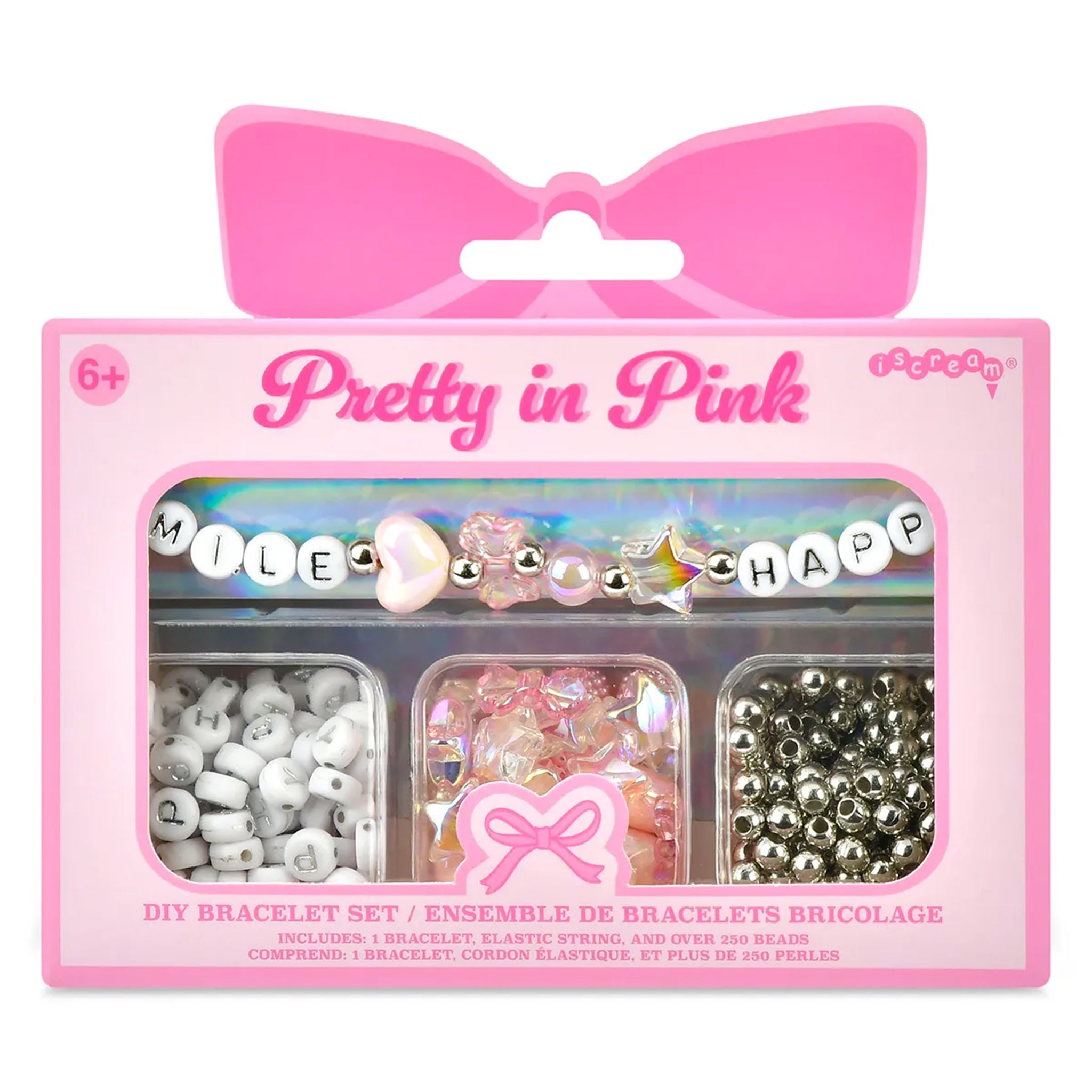 A pink DIY bracelet set in retail packaging with a bow-shaped hanger tab. The package contains three compartments with beads and charms pastel beads, and silver beads.