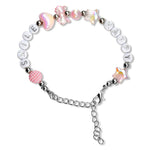 A beaded charm bracelet on a white background, featuring silver-toned round beads spelling 'SMILE', white round beads spelling 'HAPPY', iridescent pink heart and star beads, a pink patterned heart bead, and a silver chain extender.