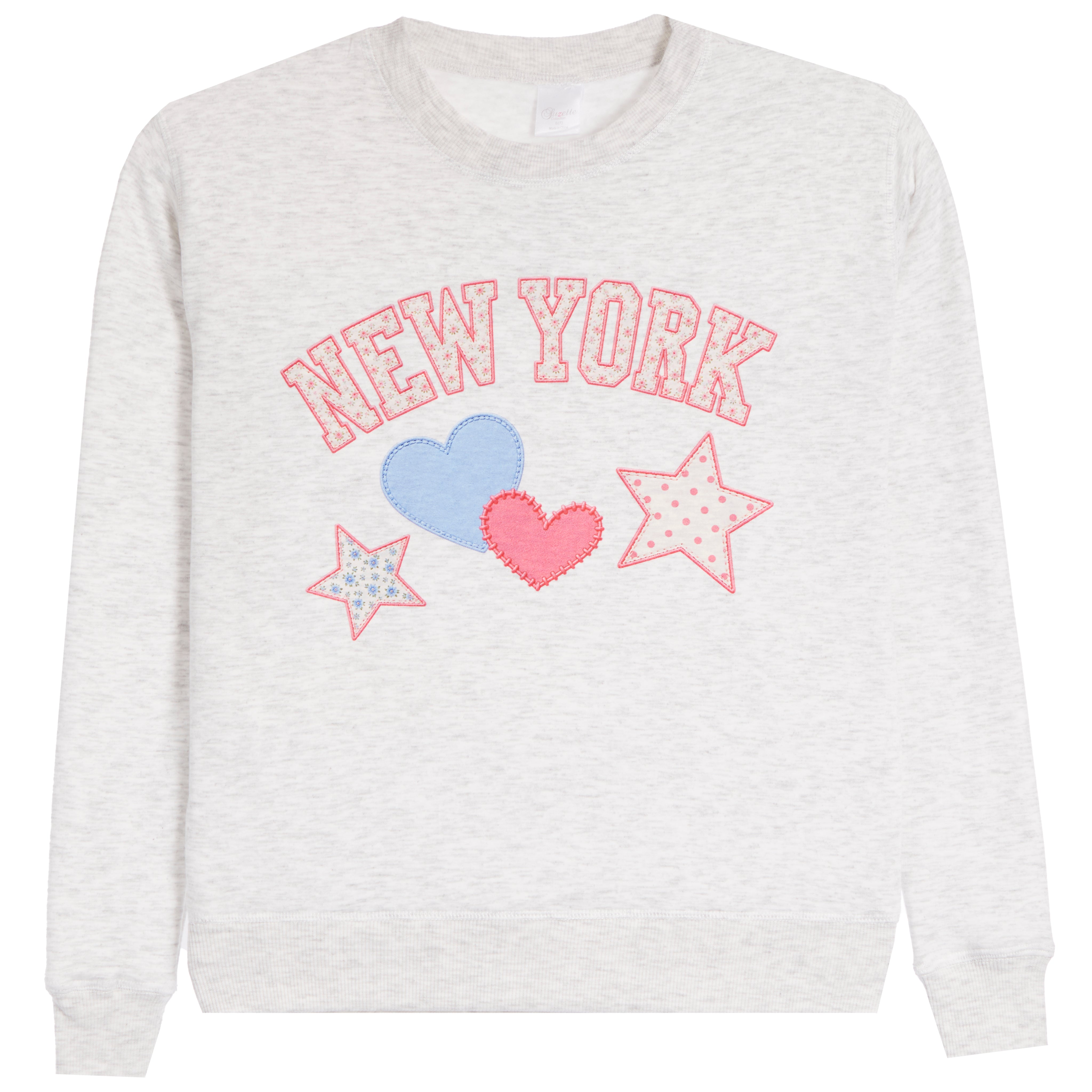 A light heather gray crewneck sweatshirt featuring a 'NEW YORK' graphic in pink outlined letters, decorated with a light blue heart, a pink heart, and two pink-outlined stars on the front.
