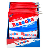 A retail display box filled with red, white, and blue Bazooka Bubble Gum plush bag toys, with metal spring clips attached along the top edges.