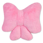 A pink plush bow-shaped cushion with a soft faux fur texture, shown against a plain white background.