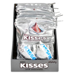 A display box filled with multiple foil packages of Hershey's Kisses milk chocolate, shown against a plain white background.