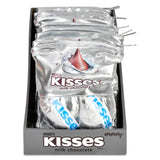 A display box filled with multiple foil packages of Hershey's Kisses milk chocolate, shown against a plain white background.