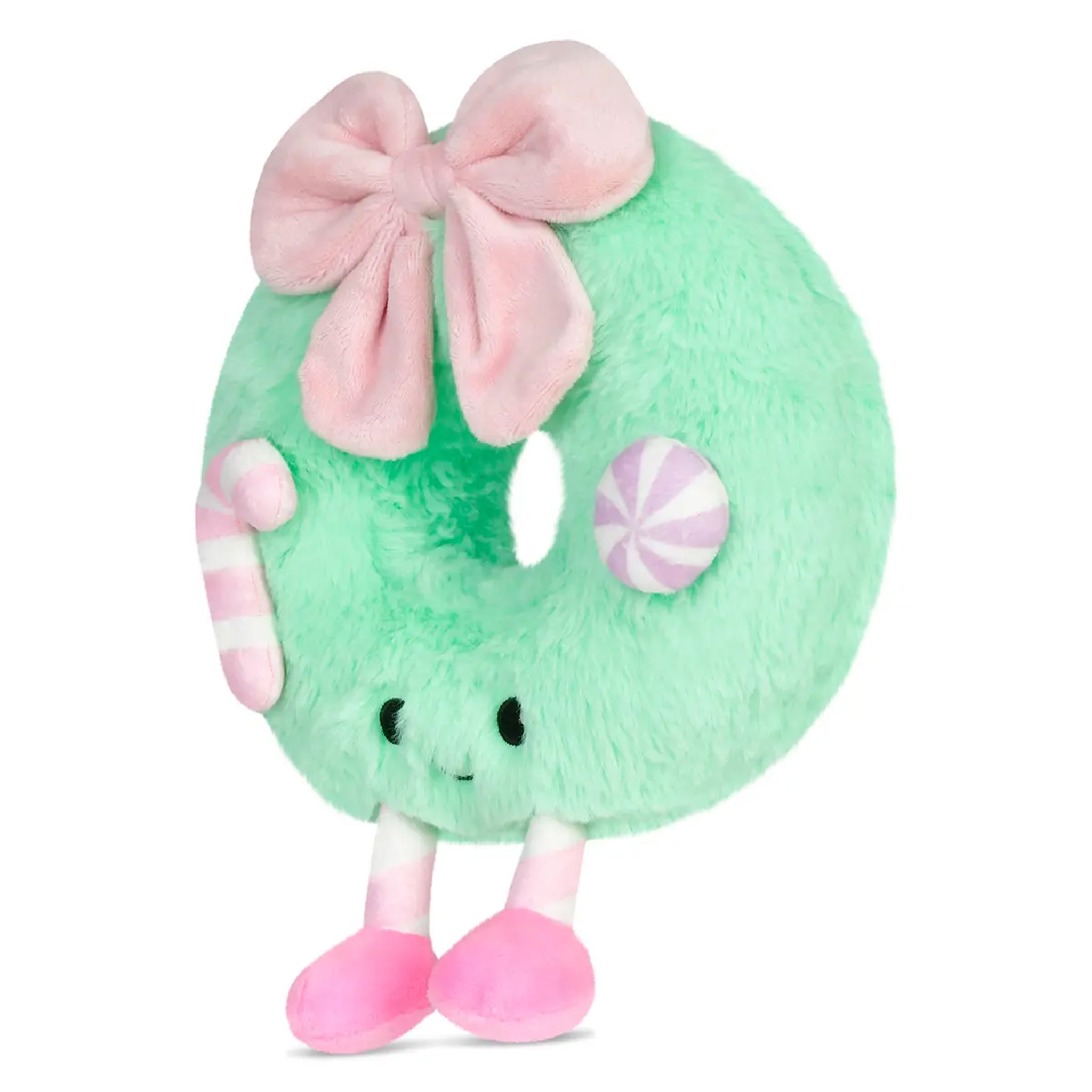 A mint green plush donut toy with a large pink bow, pink and white striped candy accents, and pink feet, shown on a plain white background.