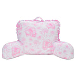 A pink and white floral lounge pillow with ruffled edges and a top carrying handle, shown on a plain white background.
