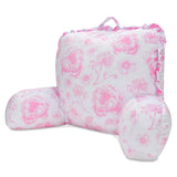 A pink and white floral lounge pillow with ruffled edges and a top carrying handle, shown on a plain white background.