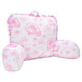 A pink and white floral lounge pillow with ruffled edges and a top carrying handle, shown on a plain white background.
