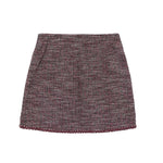 A short A-line skirt in a textured tweed bouclé fabric, featuring a marled pattern of burgundy, brown, and beige threads, finished with a matching ribbed hem.