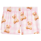 Pink and white gingham check pajama shorts featuring a repeating pattern of cute teddy bears wearing sweaters with pink hearts and bows.