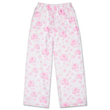 White fleece pajama pants with a pink floral pattern, featuring an elastic waistband and drawstring.