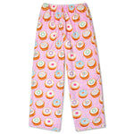 Pink children's pants with an all-over print of colorful donuts, photographed flat against a white background.