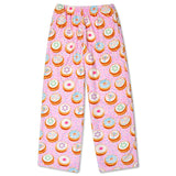 Pink children's pants with an all-over print of colorful donuts, photographed flat against a white background.