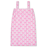 A pink and white patterned spa wrap with shoulder straps, shown flat against a white background.