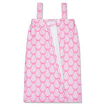 A pink and white patterned spa wrap with shoulder straps and a front tie closure, shown flat against a white background.