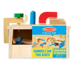 Wooden toy tool bench with tools and building pieces, featuring Melissa & Doug branding.