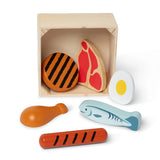 Set of wooden food toys including a burger, steak, egg, fish, and grill in a box on a white background.