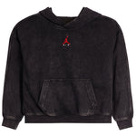 A black washed pullover hoodie with a small red Jordan logo and 'AIR' text on the center chest, displayed against a solid white background.