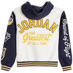 A white and navy blue hooded sweatshirt with yellow and white text reading 'JORDAN THE Greatest OF ALL TIME' on the front, plus sleeve graphics and striped ribbing.