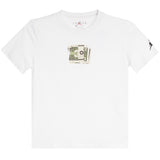 A white short-sleeve crewneck t-shirt featuring a graphic of a stack of cash on the center chest and a small black silhouette logo on the right sleeve, displayed against a plain white background.