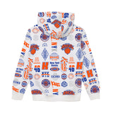 White pullover hoodie with an all-over New York Knicks graphic print in blue and orange, featuring team logos, numbers, and text.