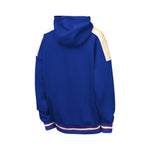 A royal blue hooded sweatshirt shown from the back, featuring cream-colored shoulder panels and striped ribbed cuffs and hem in blue, white, and red.