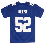 A royal blue football jersey shown from the back, featuring the name 'REESE' and number '52' in bold white block letters. The jersey has short sleeves, a crew neck, and shoulder patches, displayed flat against a solid white background.