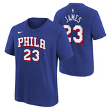 A royal blue short-sleeve t-shirt shown from both front and back. The front features 'PHILA' and '23' in white block letters with red outlines, and a small white Nike swoosh on the left chest.