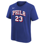 A royal blue short-sleeve t-shirt featuring 'PHILA 23' in white varsity-style lettering with red and black outlines on the front, and a small white Nike swoosh on the upper left chest.