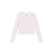 A long-sleeve crop top with a white base and a small pink floral pattern, laid flat against a solid white background.