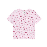 A light pink short-sleeve baby t-shirt with a small red cherry print, laid flat against a solid white background.