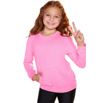 A young girl with long wavy red hair smiling and posing with a peace sign, wearing a bright pink long-sleeve crewneck sweatshirt and black leggings against a solid white background.