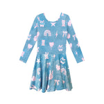 A long-sleeve blue dress with a pink and white whimsical pattern of rainbows, stars, bows, and teddy bears, shown against a plain white background.