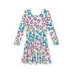 A long-sleeve white dress with a colorful heart print, featuring pink, blue, and green hearts outlined in black, displayed on a solid white background.