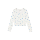 An off-white long-sleeve cropped henley top with a delicate blue and light blue floral print, displayed flat against a solid white background.